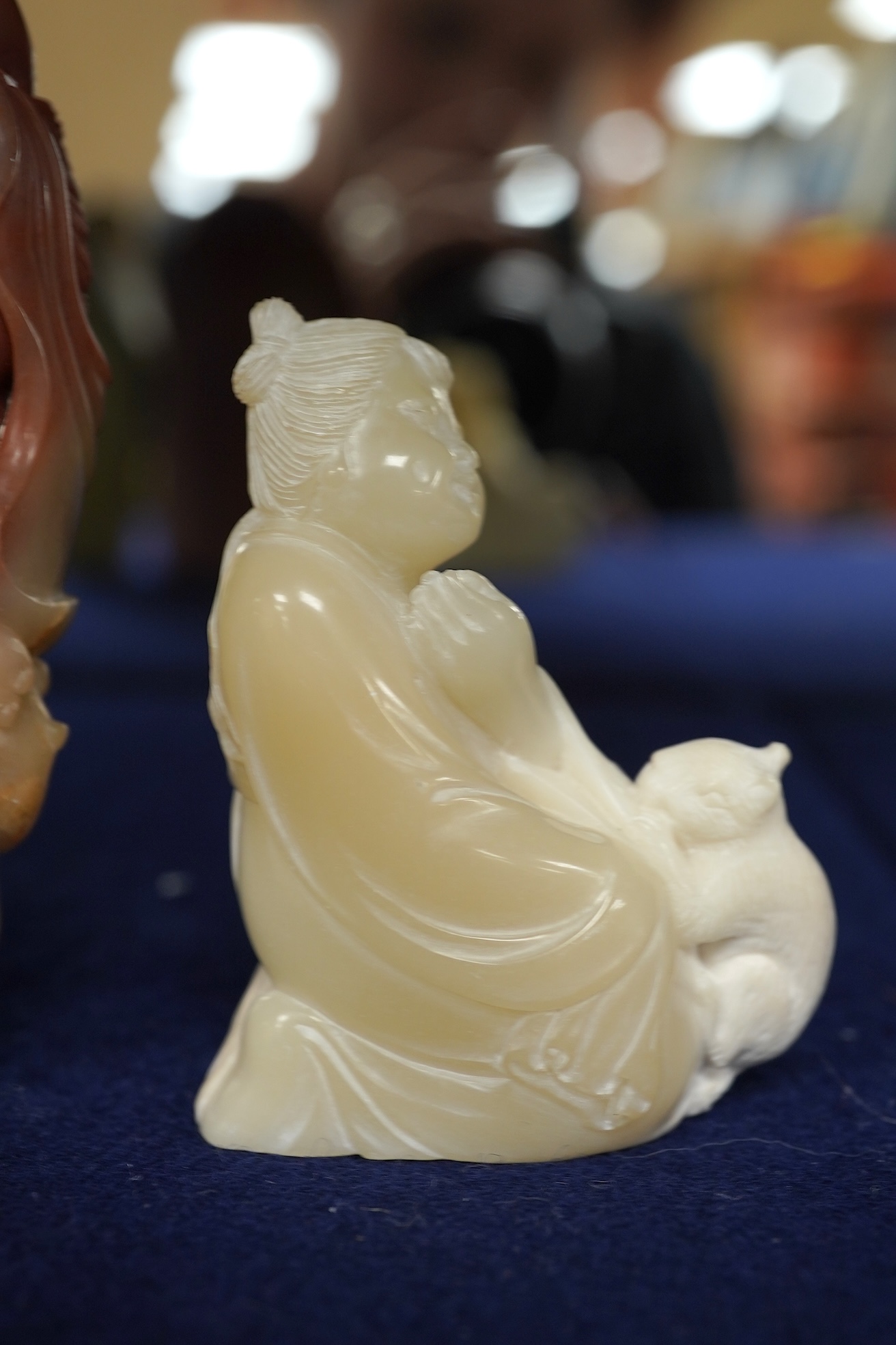 A Chinese white jade 'boys with jar' carving and three shoushan stone figures; luohan, girl with squirrel and mermaid (4), tallest 11cm